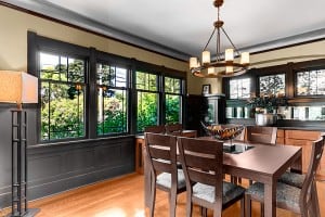 A dining room staged in Fremont neighborhood, Seattle, WA A big square dining table was the right choice for this Fremont Craftsman Style house.