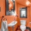 orange walls in the powder room