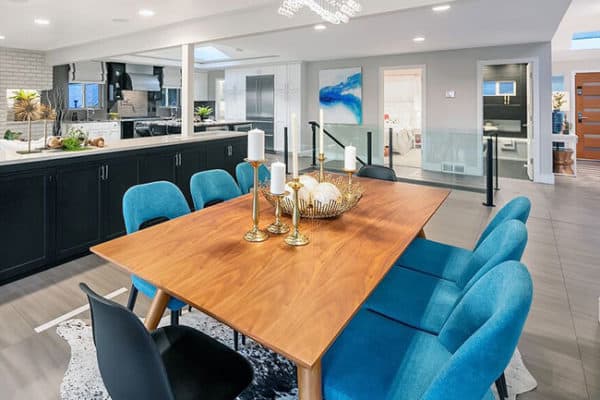 Seattle contemporary dining room design with blue color dining chairs