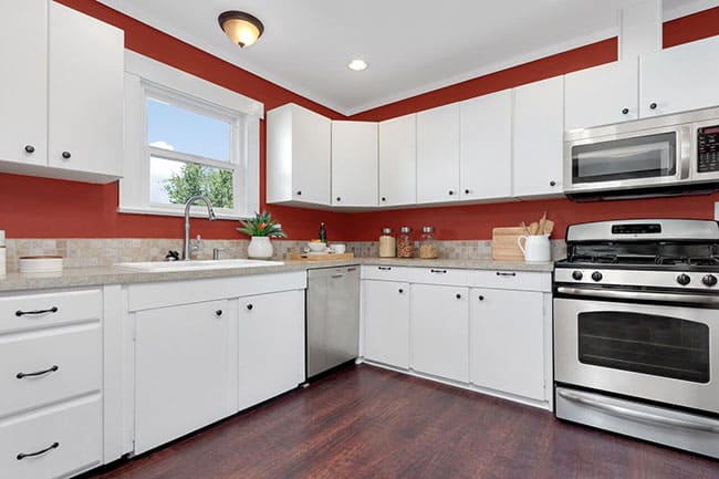 Seattle colorful kitchen design with white cabinets