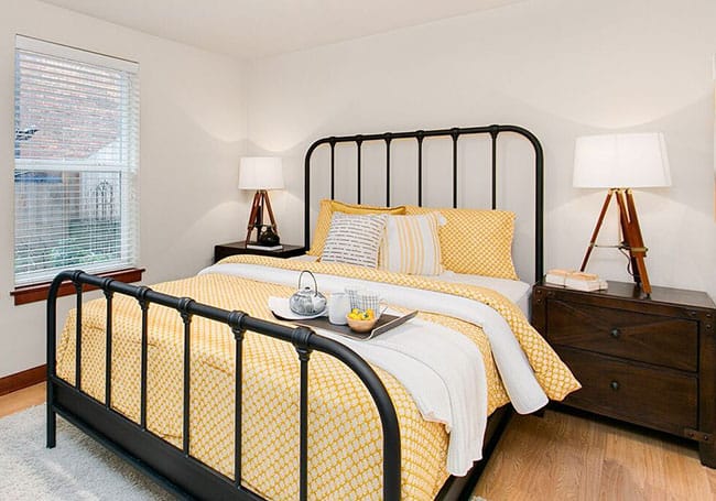 Seattle bedroom design with yellow bedding