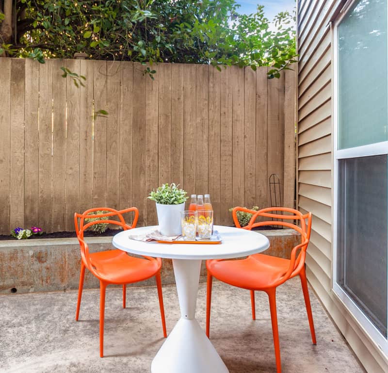 orange chair patio seating in aurora studio condo