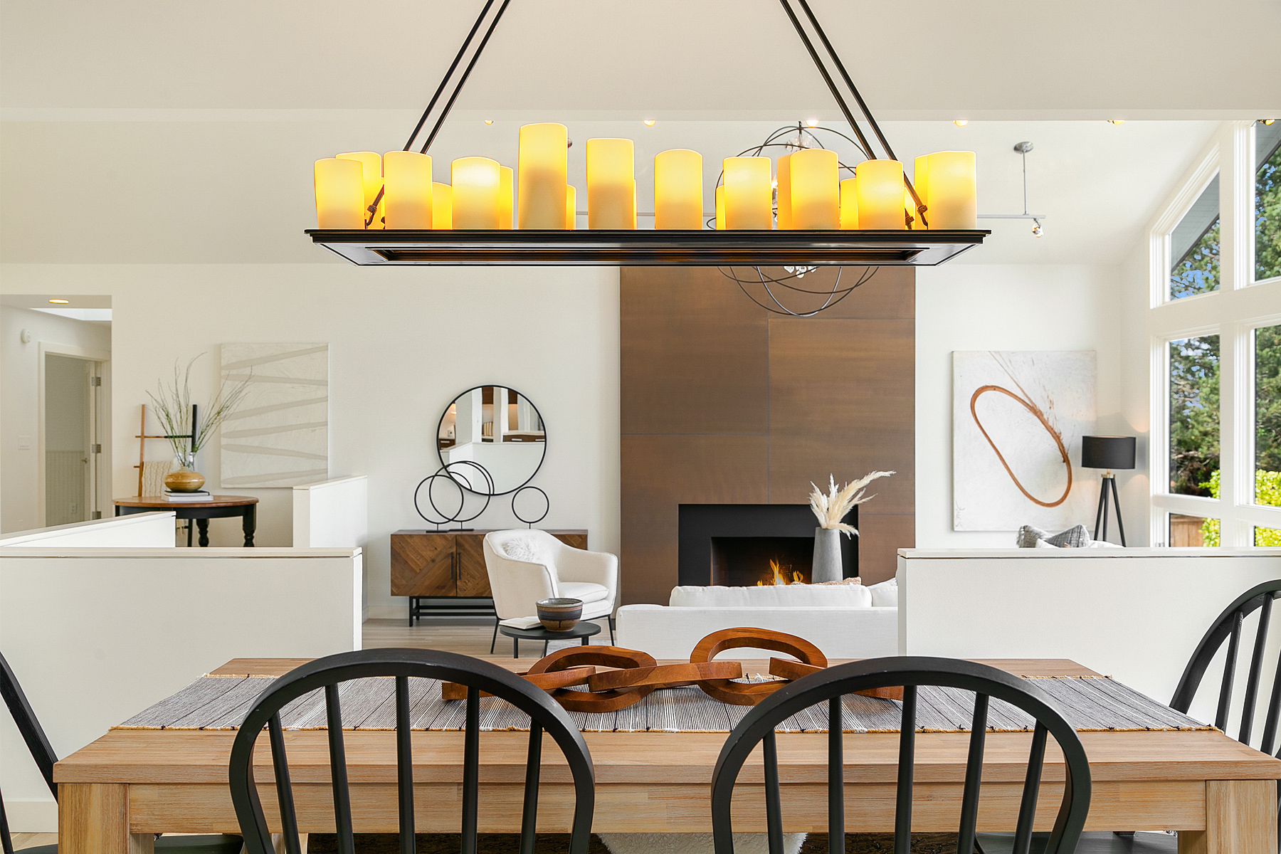 dining area with light fixture with pillar candles 