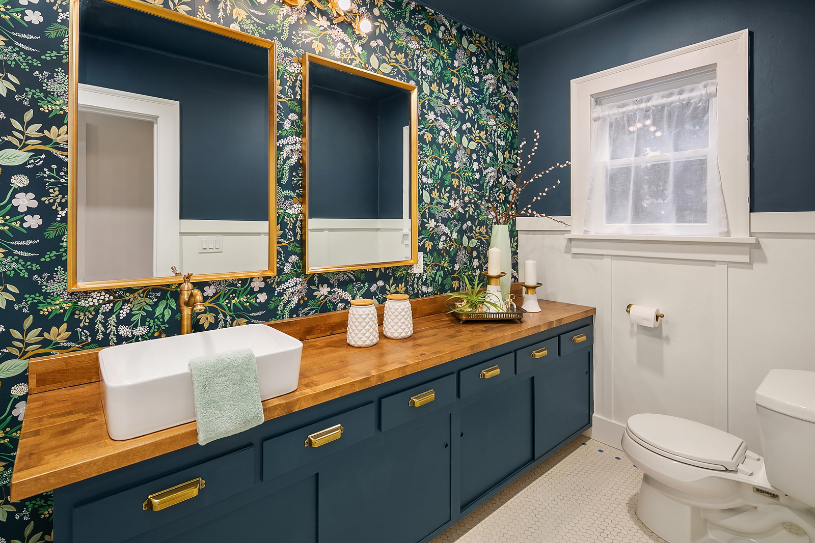 maximalist design bathroom with dark floral wall paper