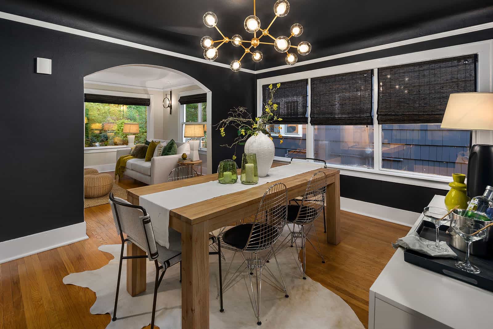 staged craftsman home with black walls in an eclectic style