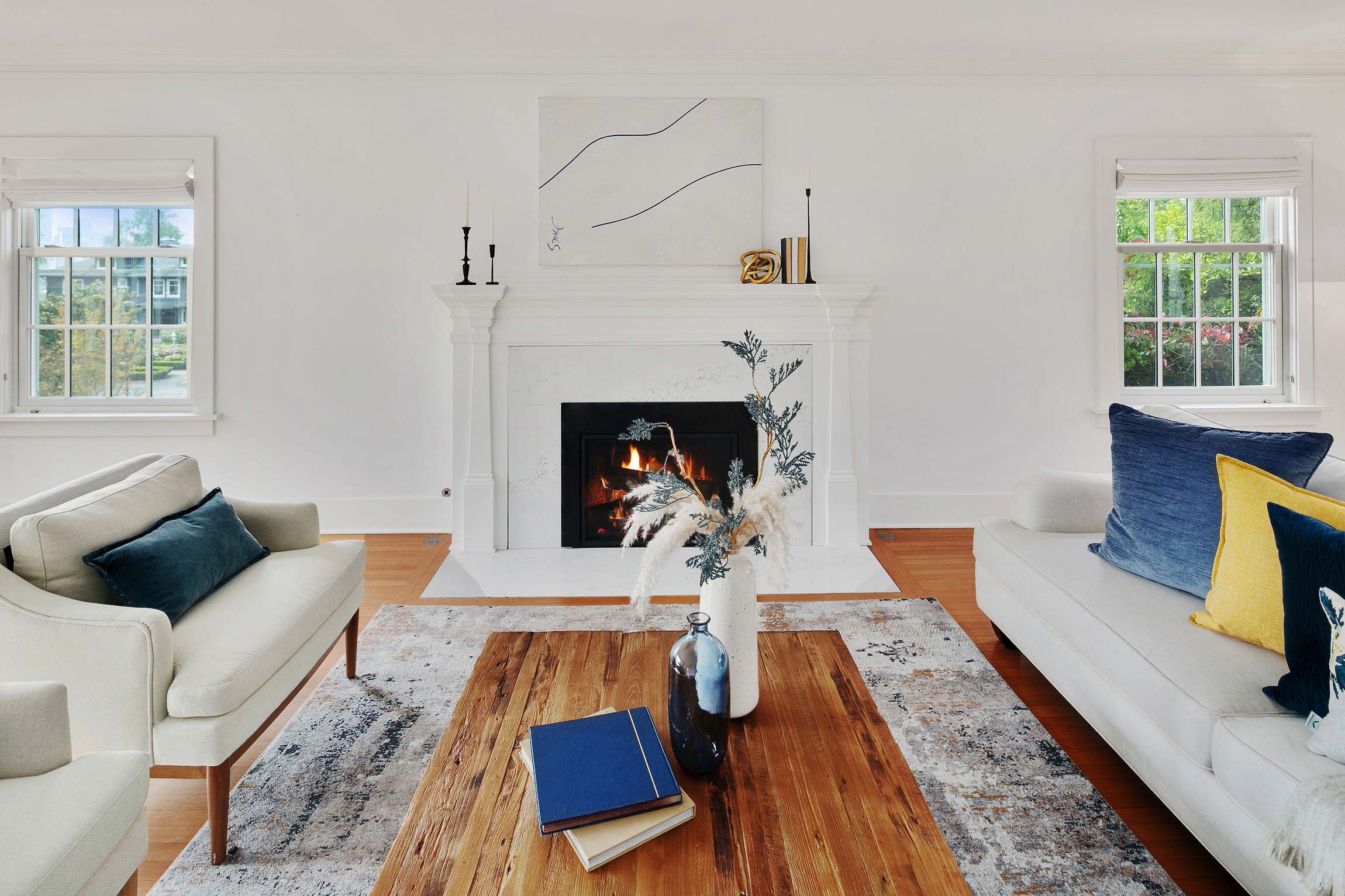 white living room with blue and yellow accents