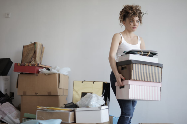 lady carrying moving boxes