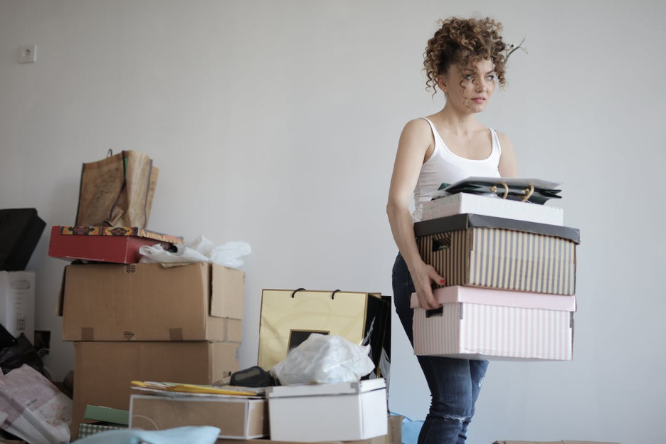 lady carrying moving boxes