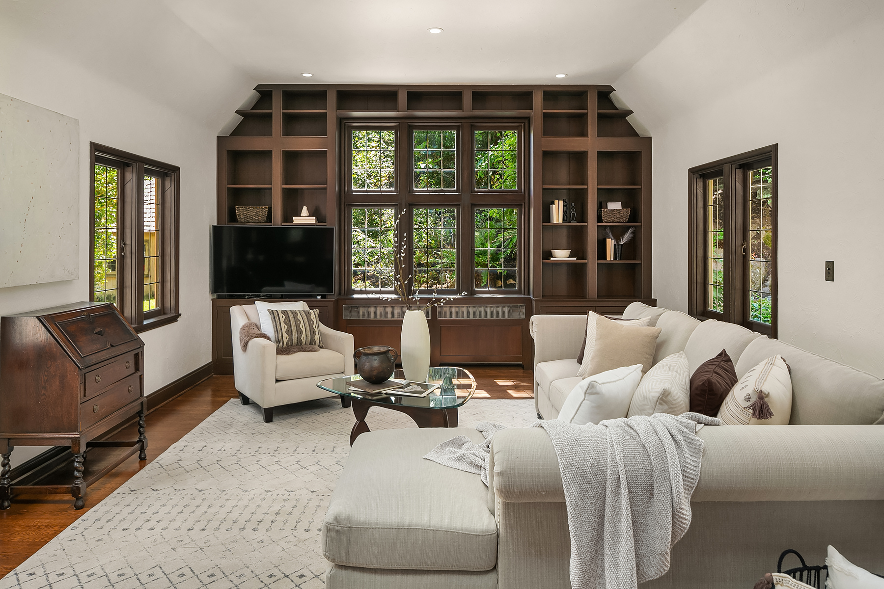 timeless transitional family room in Art Deco home with new and old pieces