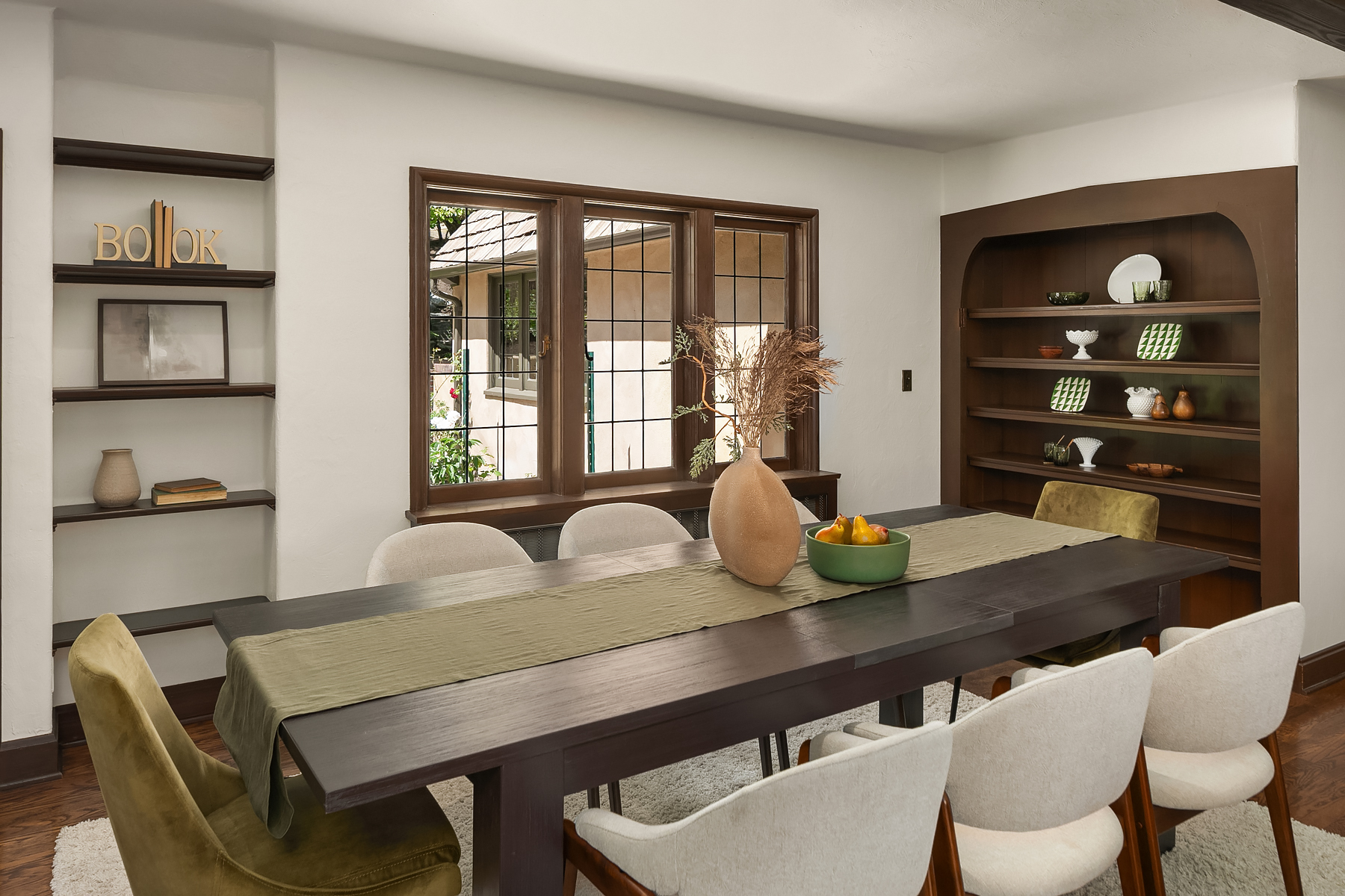 staged dining area with earth tones in luxury Art Deco home in mercer island