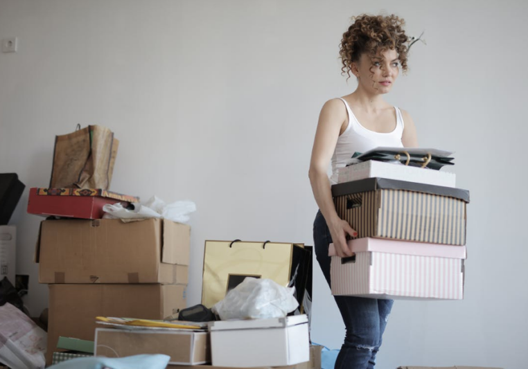 lady carrying moving boxes